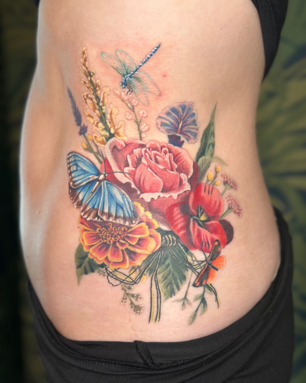 After: colorful floral bouquet coverup tattoo